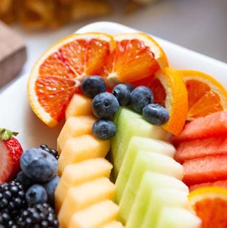 Plate of assorted fruit.