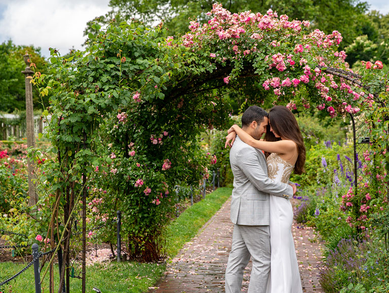 A married couple embraces at their wedding at Brooklyn Botanic Garden